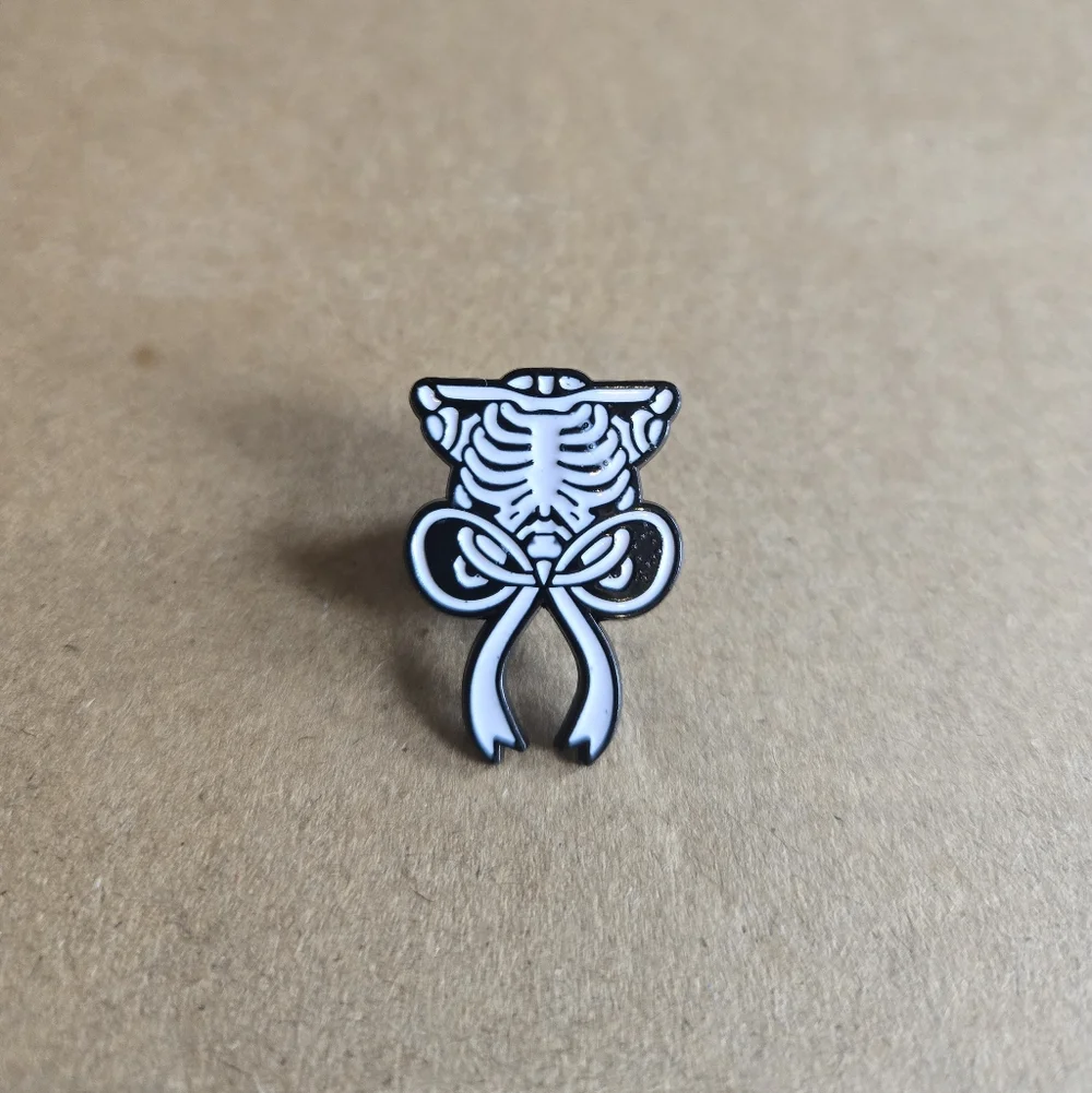 Skeleton Ribcage Bow Enamel Pin